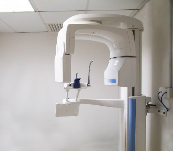 C T cone beam scanner against wall of dental office