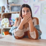 Surprised woman covering her mouth with her hands