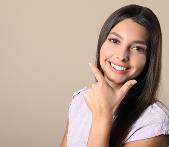 Young woman smiling with new veneers 