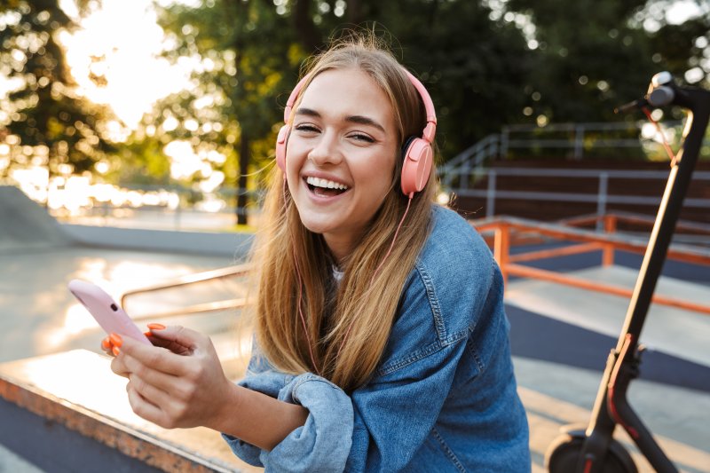 a teenage female listening to music