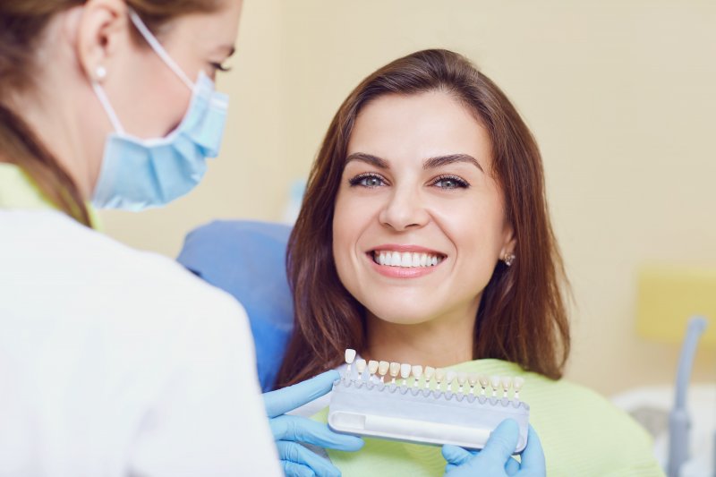 a woman preparing for cosmetic dentistry