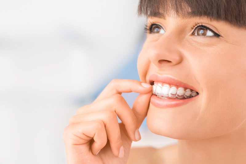 woman wearing a clear aligner