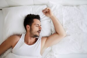 younger man asleep with his mouth open